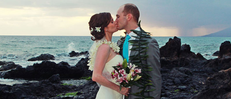 Wedding on Maui with Hawaiian blessing in the background.